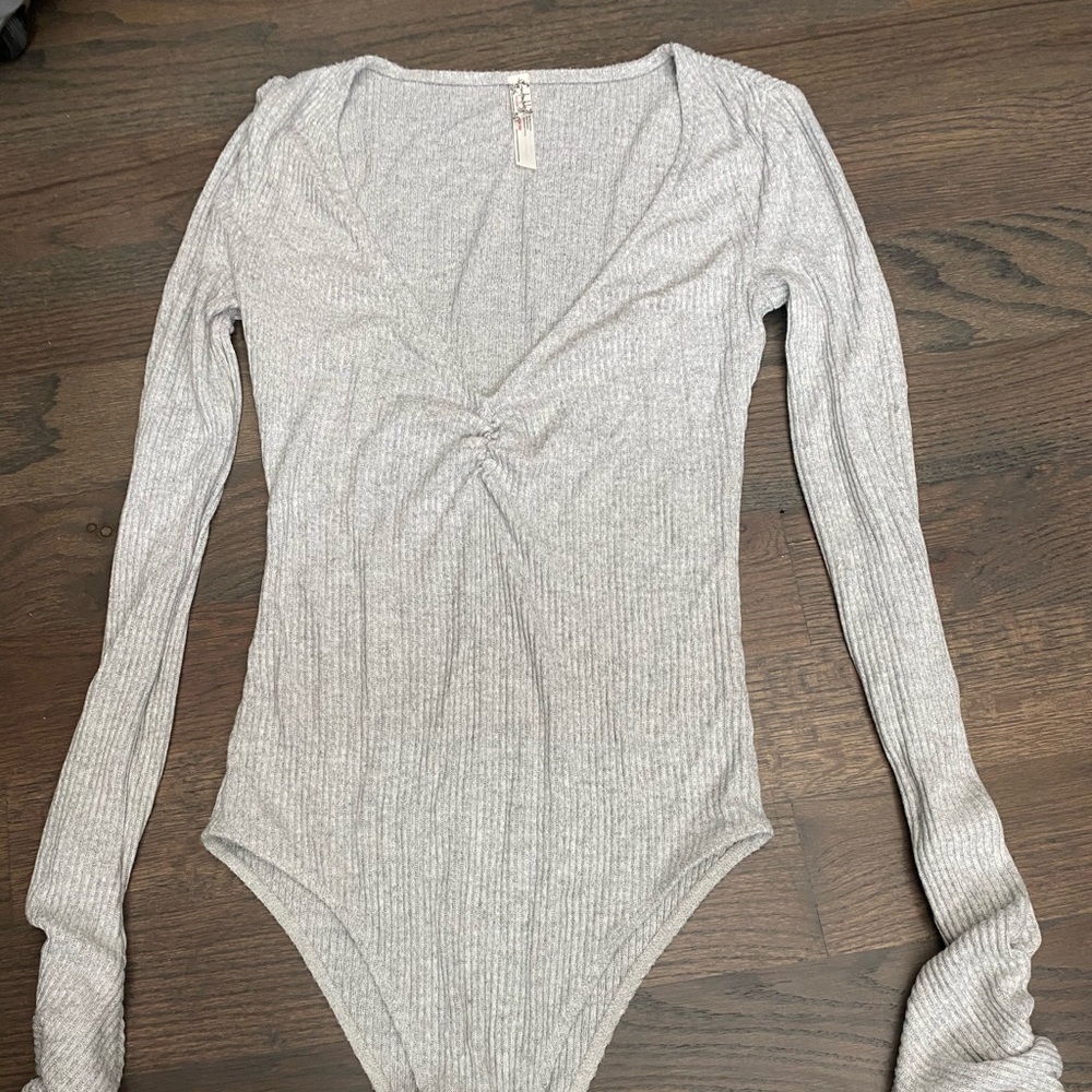 Grey long sleeved free people bodysuit